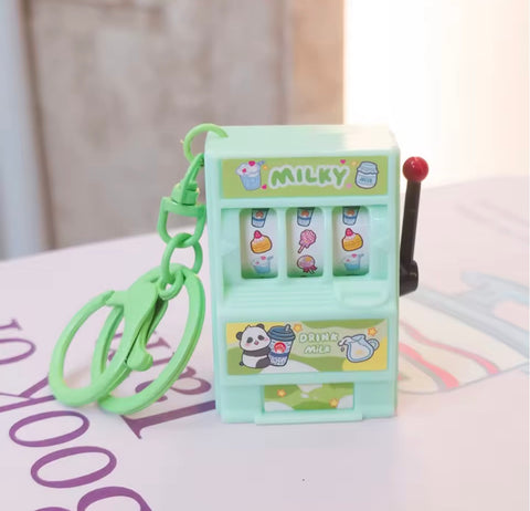 Green slot machine keychain